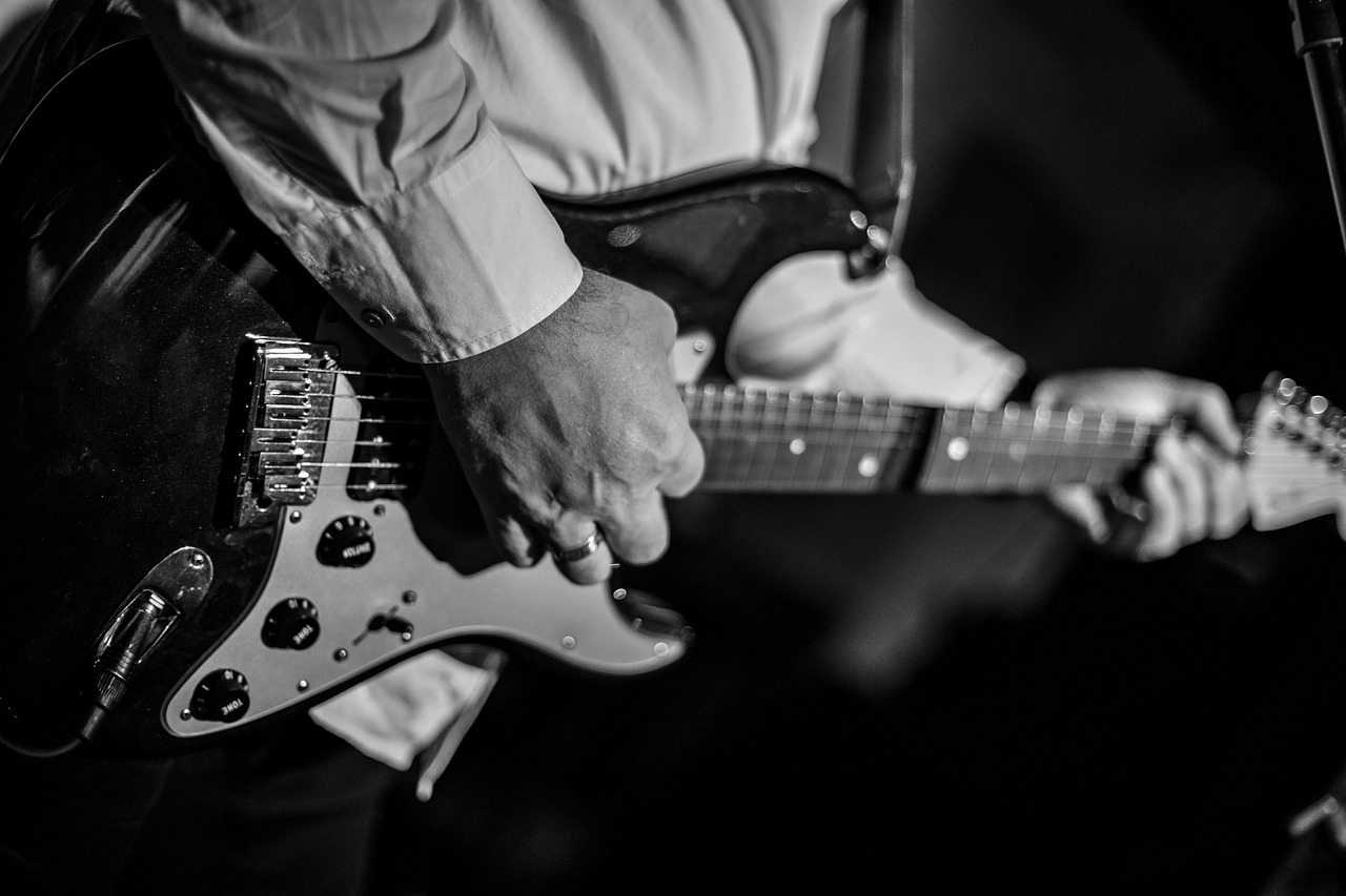An electric guitar being played.
